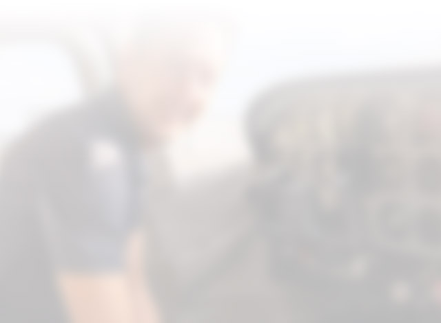 Blurred image of instructor in airplane cockpit