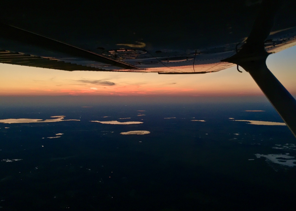 Airplane flying at dusk